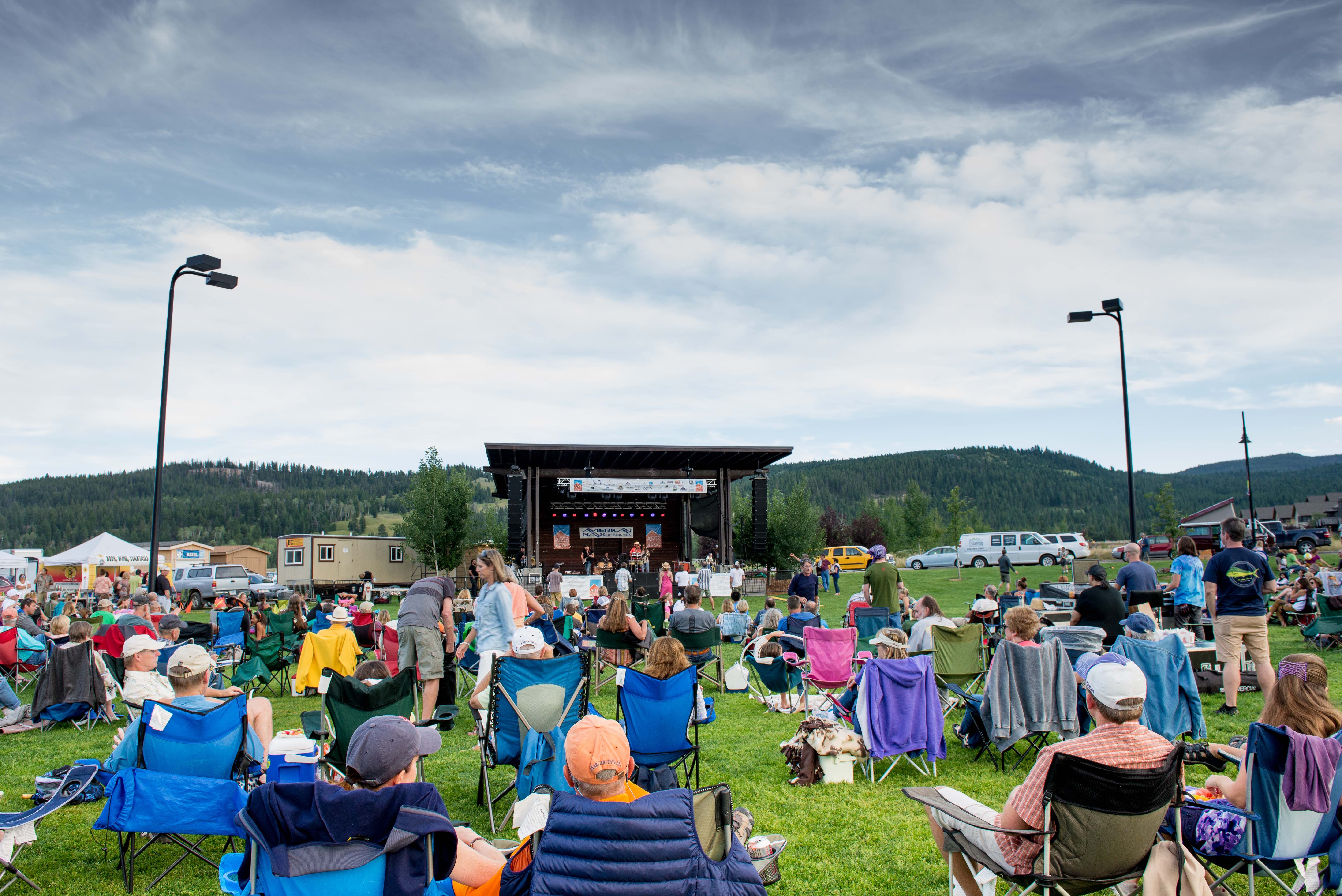 A crowd gathers for live evening music in Big Sky Town Center, Big Sky, Montana in Yellowstone Country