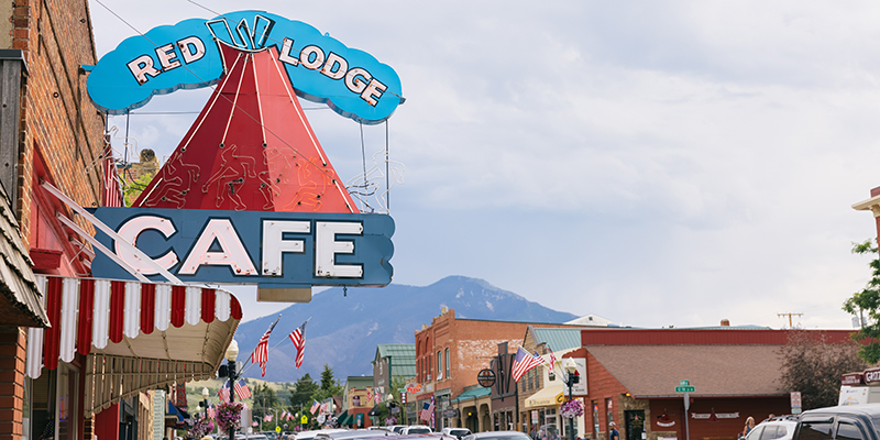 Photo of the Red Lodge Cafe sign and the town. 