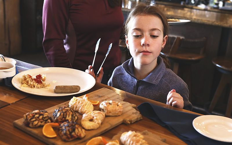 Child looking at pastries.