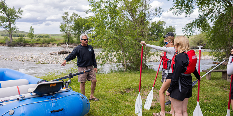 Guide getting visitors ready to float the river. 